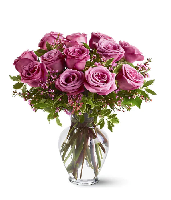 12 long stem lavender roses in a vase
