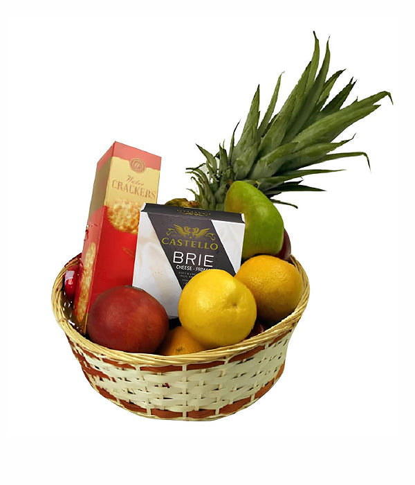 Fruit and cheese basket with brie, fruit, and crackers
